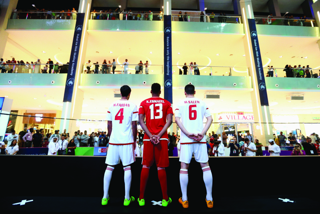 DUBAI, UNITED ARAB EMIRATES - MARCH 12:  Habib Fardan , Khamis Esmaeel and Mohanad Salem of the UAE National Football Team  pose for a picture during the launch of the UAE National team kit at adidas HomeCourt store opening on 12 March 2016 in Dubai, United Arab Emirates.  (Photo by Francois Nel/Getty Images) *** Local Caption *** Habib Fardan; Khamis Esmaeel; Mohanad Salem