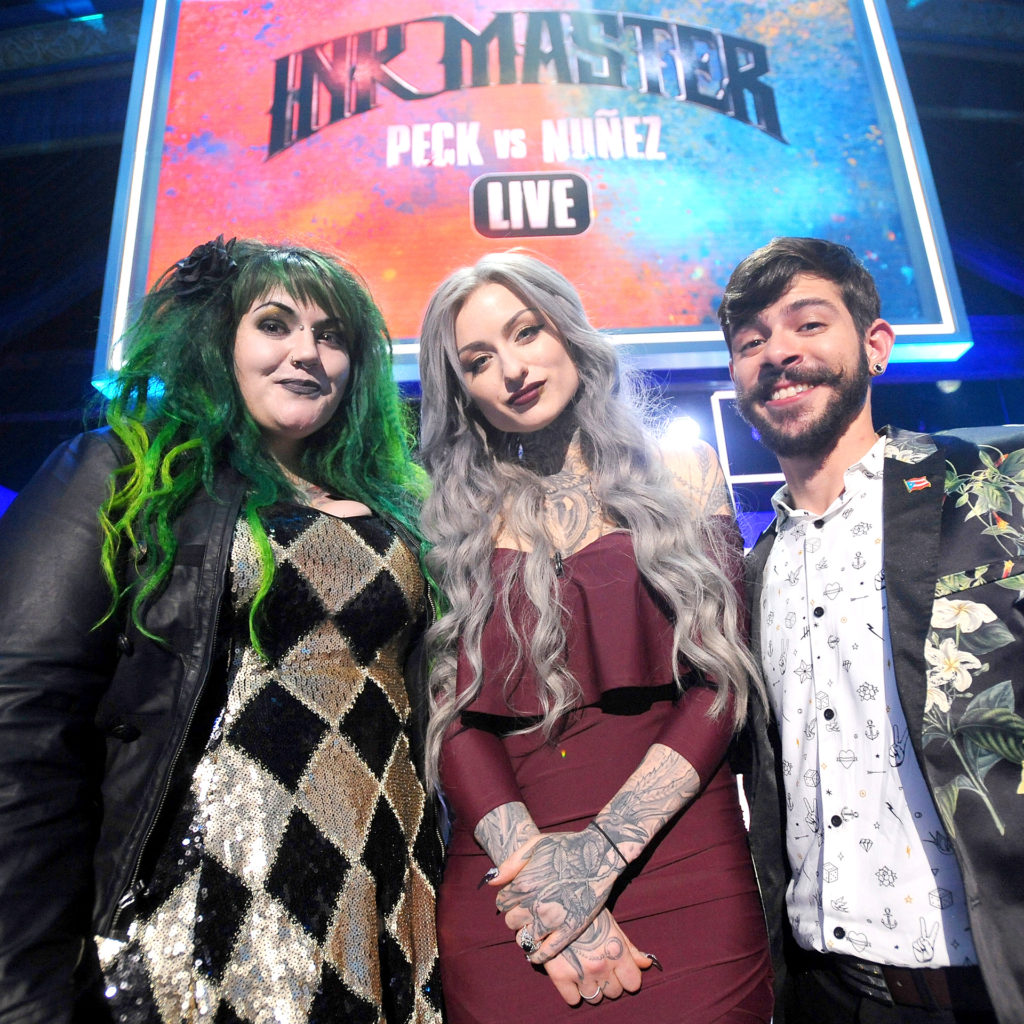 The final three contestants – Kelly Doty, owner and artist at Helheim Gallery in Salem, MA; Gian Karle, traveling tattoo artist from Puerto Rico; and Ryan Ashley, owner and artist at The Strange & Unusual Oddities Parlor in Kingston, PA (Photo courtesy of SpikeTV)