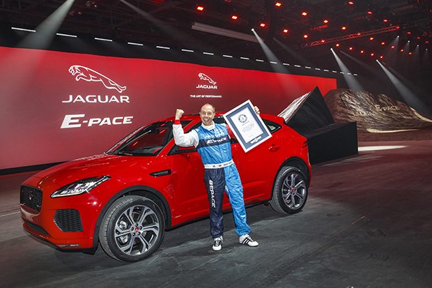 Jaguar stunt driver Terry Grant celebrates after setting a new Guinness World Record for longest barrel roll at the global launch of the new Jaguar E-PACE at ExCel London.