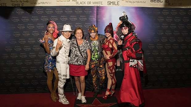 Cast members from Michael Jackson ONE pose for photos on the red carpet, Aug. 29, 2017 (Photo Credit: Michael Jackson ONE by Cirque du Soleil)