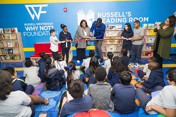 Westbrook cutting the ribbon at his 20th Russell’s Reading Room at Highland Elementary School in Inglewood