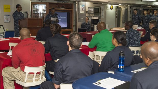 SOUTH CHINA SEA (Feb. 7, 2018) Gunner's Mate 2nd Class Tameka Seymore, from St. Louis, speaks to Sailors during an African American/Black History Month celebration on the mess decks of the amphibious assault ship USS Bonhomme Richard (LHD 6). Bonhomme Richard is operating in the Indo-Asia-Pacific region as part of a regularly scheduled patrol and provides a rapid-response capability in the event of a regional contingency or natural disaster. (U.S. Navy photo by Mass Communication Specialist 2nd Class Kyle Carlstrom/Released)