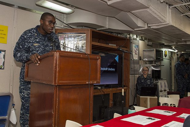 SOUTH CHINA SEA (Feb. 7, 2018) Ensign Christoff Lindsey, from Camden, N.J., speaks to Sailors during an African American/Black History Month celebration on the mess decks of the amphibious assault ship USS Bonhomme Richard (LHD 6). Bonhomme Richard is operating in the Indo-Asia-Pacific region as part of a regularly scheduled patrol and provides a rapid-response capability in the event of a regional contingency or natural disaster. (U.S. Navy photo by Mass Communication Specialist 2nd Class Kyle Carlstrom/Released)