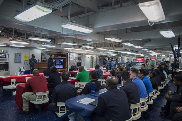 SOUTH CHINA SEA (Feb. 7, 2018) Capt. Larry McCullen, commanding officer of the amphibious assault ship USS Bonhomme Richard (LHD 6), delivers closing remarks during an African American/Black History Month celebration on the ship’s mess decks. Bonhomme Richard is operating in the Indo-Asia-Pacific region as part of a regularly scheduled patrol and provides a rapid-response capability in the event of a regional contingency or natural disaster. (U.S. Navy photo by Mass Communication Specialist 2nd Class Kyle Carlstrom/Released)