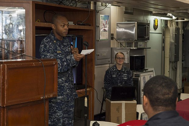 SOUTH CHINA SEA (Feb. 7, 2018) Chief Fire Controlman Elanthesus Davis, from Columbus, Miss., speaks to Sailors during an African American/Black History Month celebration on the mess decks of the amphibious assault ship USS Bonhomme Richard (LHD 6). Bonhomme Richard is operating in the Indo-Asia-Pacific region as part of a regularly scheduled patrol and provides a rapid-response capability in the event of a regional contingency or natural disaster. (U.S. Navy photo by Mass Communication Specialist 2nd Class Kyle Carlstrom/Released)