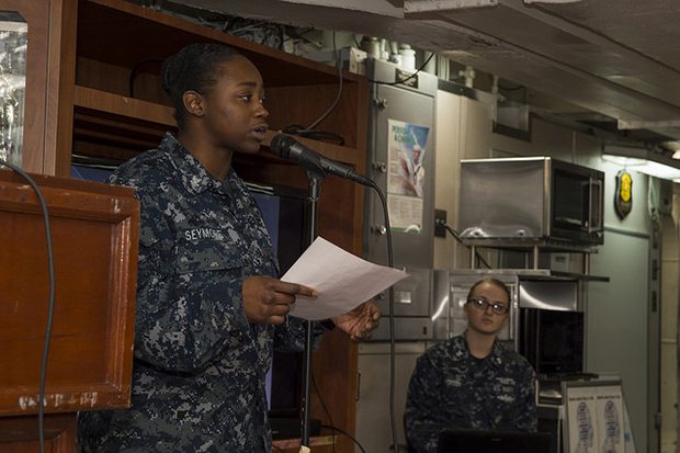 SOUTH CHINA SEA (Feb. 7, 2018) Gunner's Mate 2nd Class Tameka Seymore, from St. Louis, speaks to Sailors during an African American/Black History Month celebration on the mess decks of the amphibious assault ship USS Bonhomme Richard (LHD 6). Bonhomme Richard is operating in the Indo-Asia-Pacific region as part of a regularly scheduled patrol and provides a rapid-response capability in the event of a regional contingency or natural disaster. (U.S. Navy photo by Mass Communication Specialist 2nd Class Kyle Carlstrom/Released)