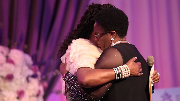 Trayvon Martin's mother, Sybrina Fulton, embraces Botham Jean's mother, Allison Jean, during the God's Leading Ladies gala in Dallas.