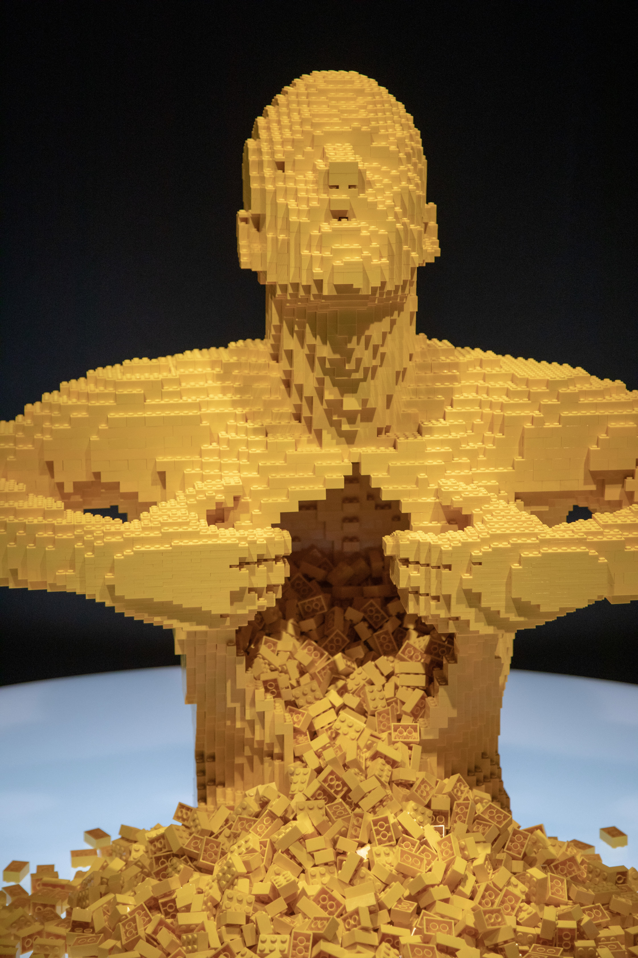 The fan favorite Yellow is a life-size sculpture of a man ripping his chest open with thousands of yellow LEGO bricks cascading from the cavity. (Yellow has gained pop-culture fame appearing on fashion labels, album covers and even in Lady Gaga’s music video “G.U.Y.”) (PHOTO CREDIT: JerSean Golatt/Perot Museum of Nature and Science)