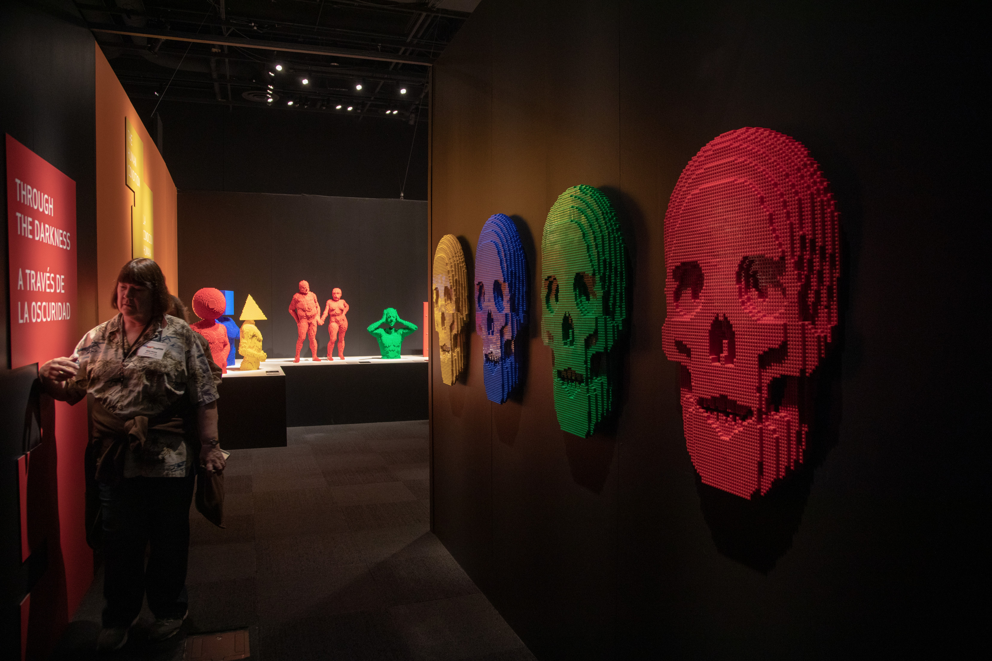 Skulls adorn the walls in the “Through the Darkness” gallery of The Art of the Brick traveling exhibition (PHOTO CREDIT: JerSean Golatt/Perot Museum of Nature and Science)