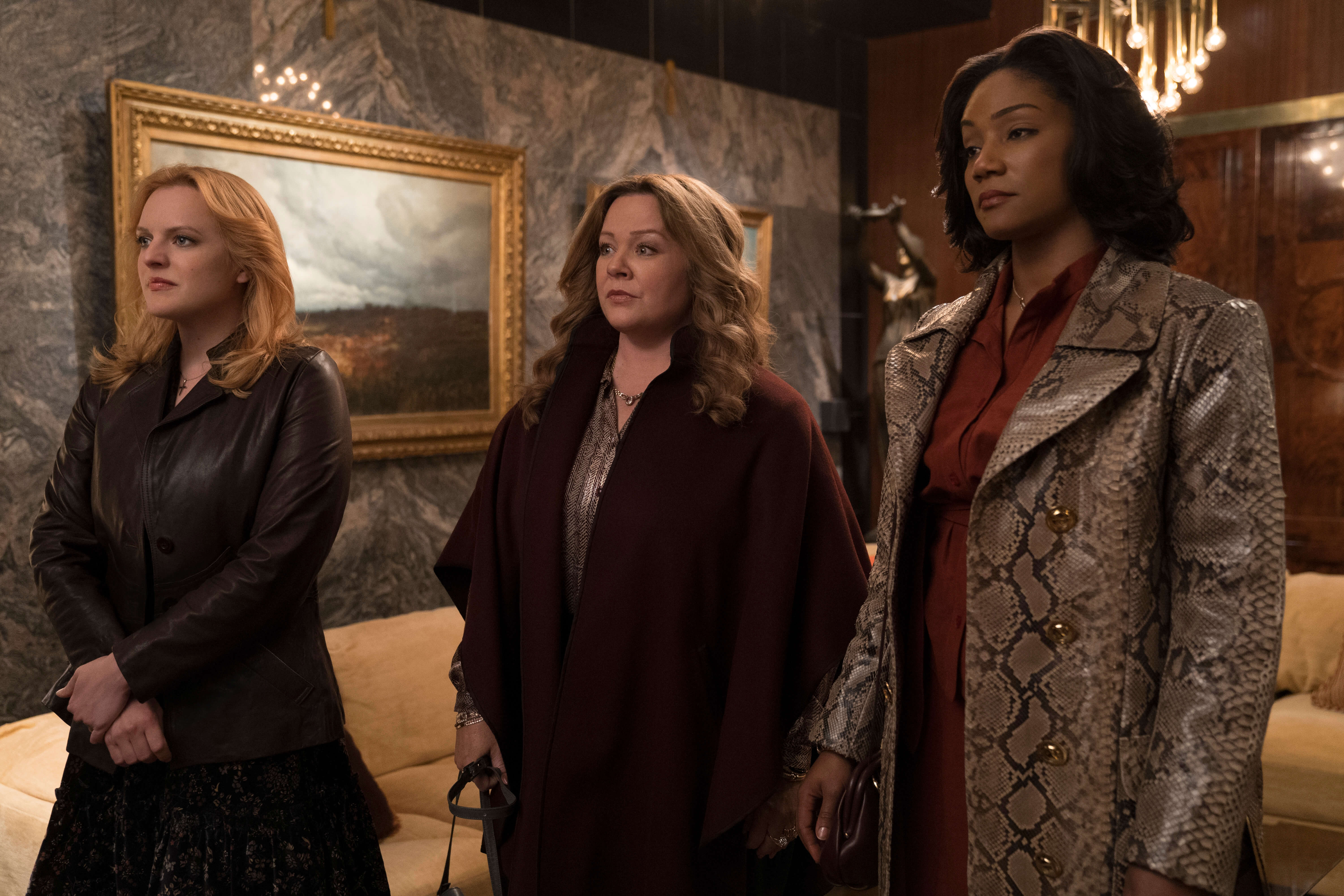 (L-R) ELISABETH MOSS as Claire, MELISSA McCARTHY as Kathy and TIFFANY HADDISH as Ruby in New Line Cinema’s mob drama “The Kitchen,” a Warner Bros. Pictures release. (Photo Credit: Alison Cohen Rosa) Copyright: © 2019 WARNER BROS. ENTERTAINMENT INC.