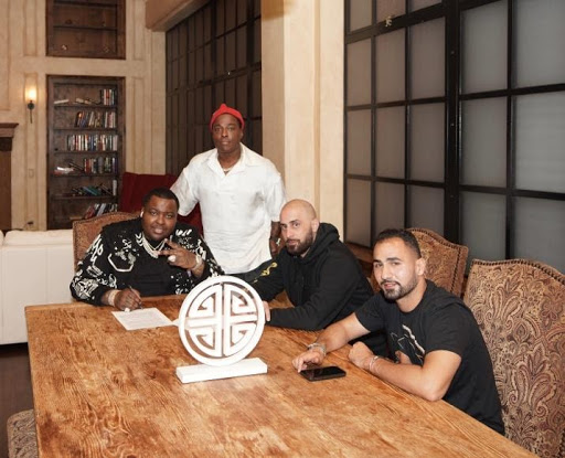 Sean Kingston Signing Deal at EMPIRE’s San Francisco Headquarters (Pictured from left: Sean Kingston, Won-G, Kingston Manager, Ghazi, EMPIRE Founder & CEO, Nima Etminan, EMPIRE VP)