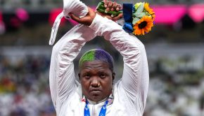 U.S. shot putter Raven Saunders protests on the podium with her silver medal after competing the women’s shot put. Ina Fassbender/AFP via Getty Images