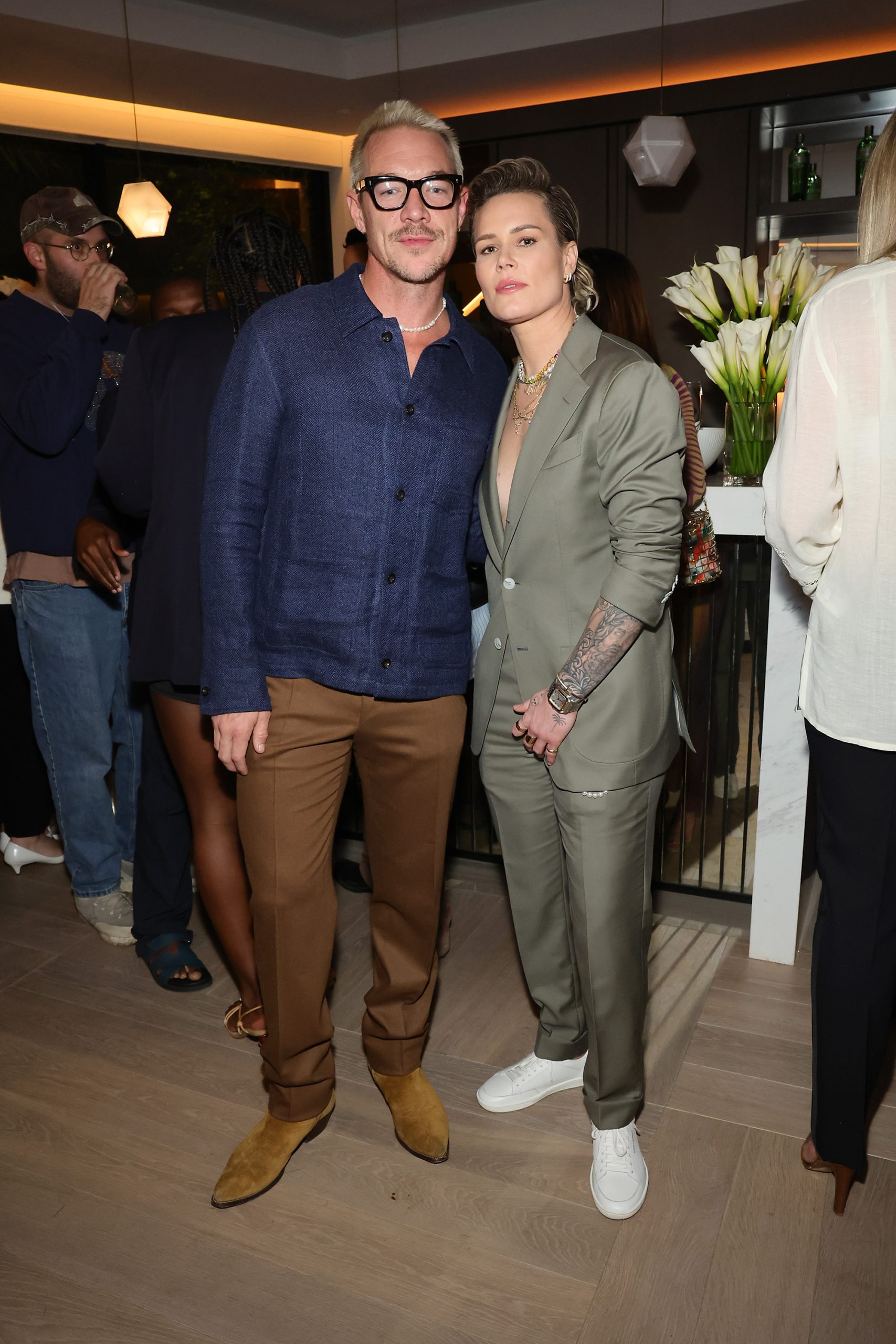 MIAMI BEACH, FLORIDA - DECEMBER 07: (L-R) Diplo and Ashlyn Harris attend W Magazine And Ralph Lauren's Art Basel Celebration on December 07, 2023 in Miami Beach, Florida. (Photo by Arturo Holmes/Getty Images for W Magazine)